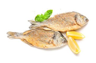 Fried dorado with lemon and basil on white background