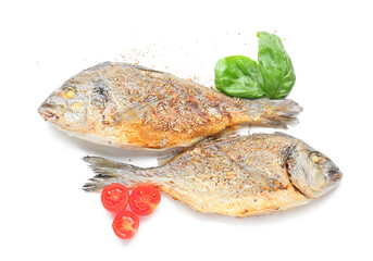 Fried dorado with tomatoes and basil on white background