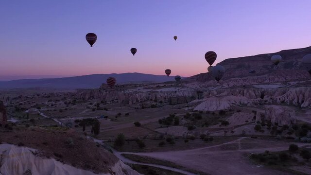 parade of balloons taking off at dawn in Cappadocia. travel concept