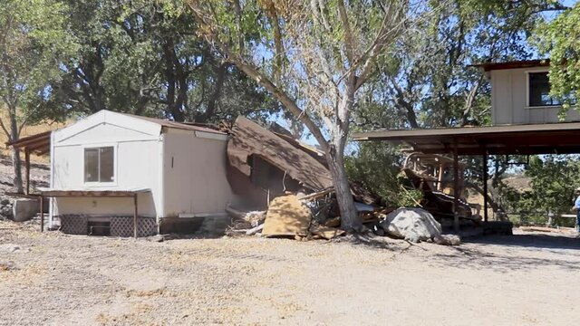 House Getting Knocked Down By Dozer