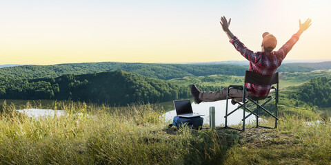 Happy traveler man and enjoying mountains nature at sunset. Freedom, remote work, freelancer,...