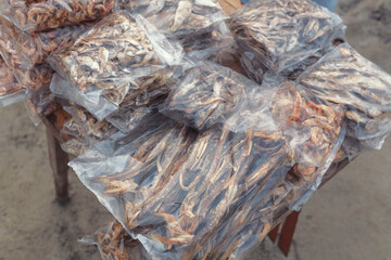 Closeup of dried sea fish (mostly asian ribbon and shrimps) in plastic pouch for sale near Kargil sea beach at Fraserganj. These are popularly known as shutki maach and a delicacy in West Bengal.