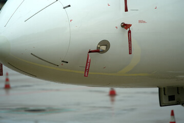 Close-up of plane at Zurich Airport with protected sensors with text remove before flight. Photo...