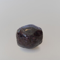 Garnet almondite - polished on white background