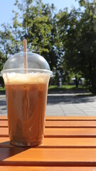 cold coffee on a park bench