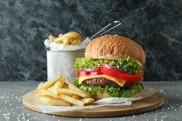 Concept of tasty food with delicious burger