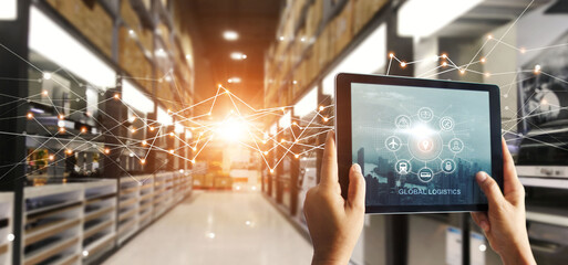 Hands hold tablet with global logistics network app at distribution warehouse. Intelligent...