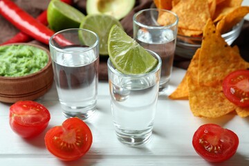 Party concept with tequila, guacamole and chips
