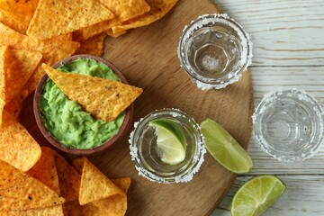 Party concept with tequila, guacamole and chips