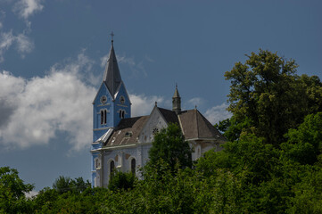 Fototapeta na wymiar Stribrnice village in Czech Republic, with the beautiful blue Saint Procopius church