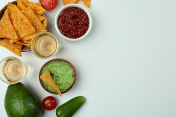 Party concept with tequila, guacamole and chips