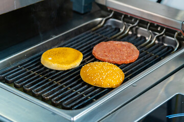Delicious frying cutlet on the grill. Roasted cooking grill dinner.