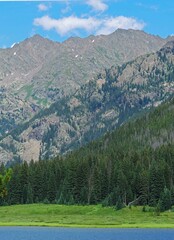 piney lake and the gore range in summer, near vail,  in the rocky mountains of colorado    