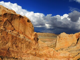   the  steep red rock formations of burr trail on a sunny day near capitol reef park in  central...