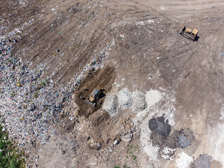 Aerial view of huge rubbish dump. Trash and garbage landfill. Ecology problem, nature pollution. Consumerism economy cons.