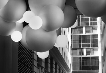 Unique white modern spherical lighting in the tunnel at Wynyard station in the Sydney. Central business district. Monochrome image - Powered by Adobe