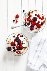 Granola with yogurt, strawberries, blackberries and blueberries