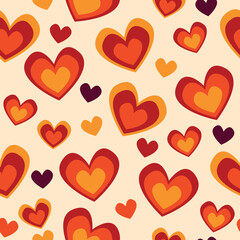 Retro 70's love heart seamless vector pattern. Yellow, orange, red and purple scattered heart shapes on beige background. Funky, groovy seventies style design. Repeat backdrop wallpaper texture print.