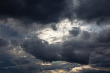 Naklejka na ściany i meble Dark clouds covered the sky . Black sky before rain 