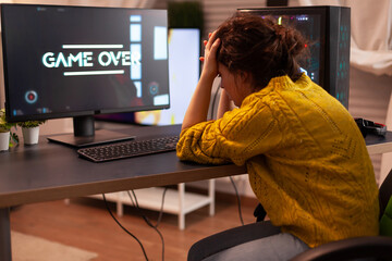Angry pro gamer while playing shooter games beacuse she losing. Gamer over of mock-up videogame...