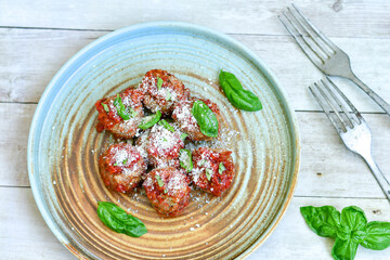 Tasty home made    italian  dish mini  meatballs baked in marinara tomato  sauce