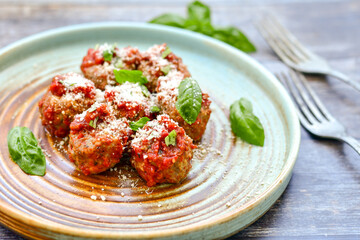 Tasty home made    italian  dish mini  meatballs baked in marinara tomato  sauce
