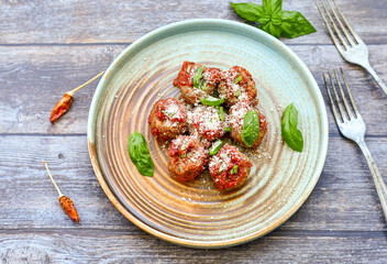 Tasty home made    italian  dish mini  meatballs baked in marinara tomato  sauce