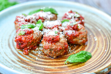 Tasty home made    italian  dish mini  meatballs baked in marinara tomato  sauce