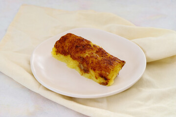 cheese dessert on a white wooden background. Local name peynir tatlisi