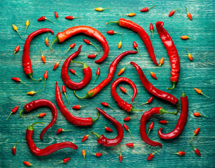 Red peppers on a flat surface. Image for use as background. Flat lay.