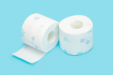 Roll of toilet paper on blue background