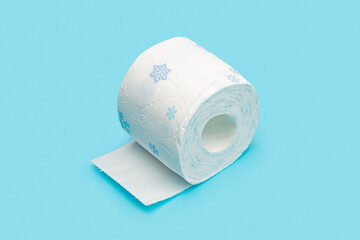 Roll of toilet paper on blue background