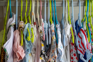 Children cloths on hanger background.
