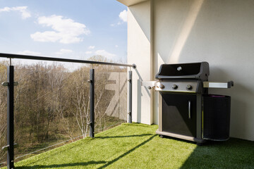 New gas grill on spacious terrace
