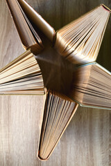 Vintage hardcover books on a wooden table. Top view.