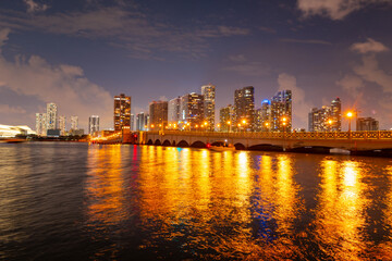Fototapeta na wymiar Miami city. Miami skyline panorama at dusk with skyscrapers over sea. Night downtown sanset.