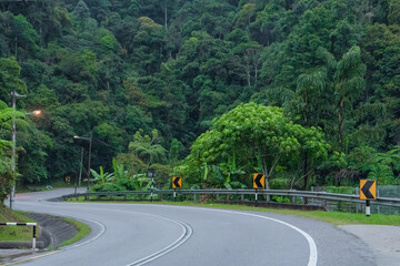 Mountain serpentine asphalt road in the Asian mountain jungle