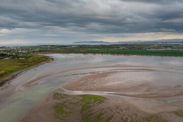 Irish textured landscape and water reflections at sunset.Rogerstown Estuary at sunset, aerial view.