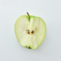 half a green apple on a white background