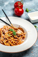 Spaghetti with bolognese sauce. Traditional Italian cuisine, cooking concept, vertical image. copy space