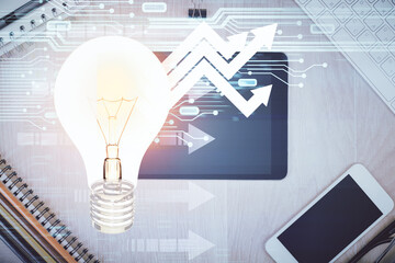 Double exposure of bulb drawing over table with phone. Top view. Concept of idea.