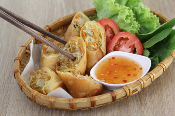 Fried spring rolls on a white plate