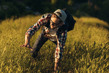 Tourist climbing to the summit, Young man climbing a mountain, Climber success on the summit,...