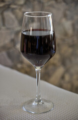Alentejo red wine glass with the stone background.