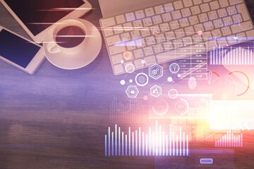 Double exposure of technology theme drawing over work table desktop. Top view. Global data analysis concept.