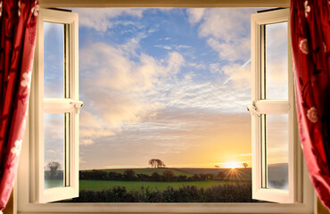 Open window view onto rural sunrise