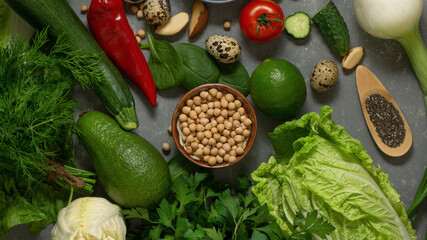 Fresh healthy vegetables with avocado, chickpeas, nuts and herbs for a healthy diet. A balanced diet with fiber and vegetable proteins