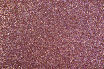 Fototapeta premium Texture of red sparkles, close up, bright colorful texture, close up