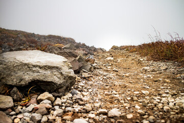 Fototapeta na wymiar 霧に包まれた茶臼岳（那須岳）の登山道 【A misty trail at Mt. Nasu】