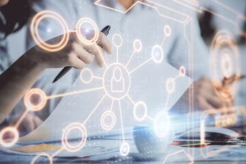 Double exposure of social network theme drawing over people taking notes background. Concept of human connection